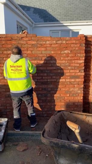 Lad pranks friend by removing bricks as he's cementing them in collection item